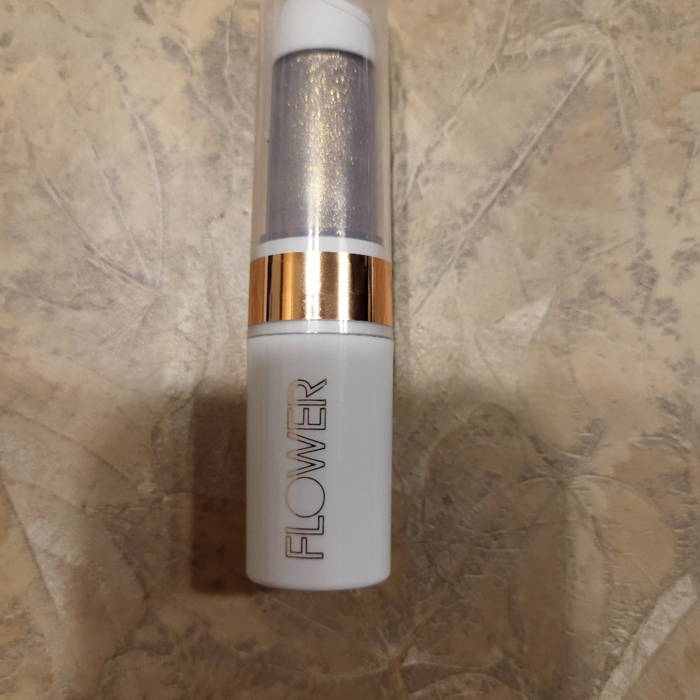 Flower Beauty Lipstick with Gold Accent. New has never been used